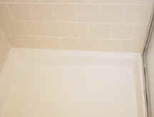 Shower Pan - after - cleaned out all grout joints and removed caulking. The entire shower was Re-Grouted and re-caulked.�